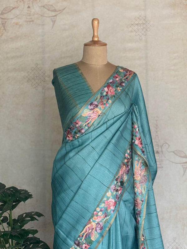 Vasantika - Aqua Blue Pure Tussar Saree with Floral Embroidered Borders