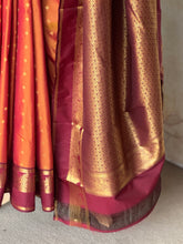 Semi Kanchi Silk Saree in Burnt Orange with Magenta Zari Border & Traditional Buttas