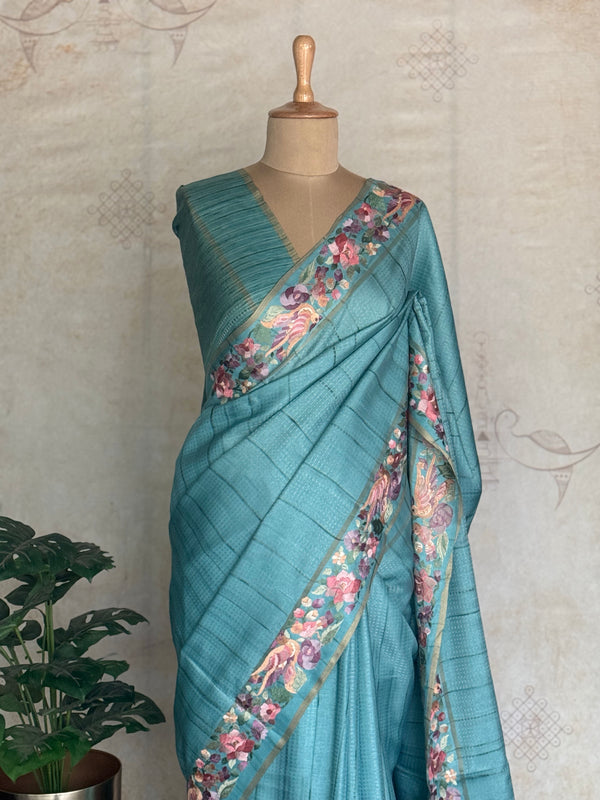 Vasantika - Aqua Blue Pure Tussar Saree with Floral Embroidered Borders