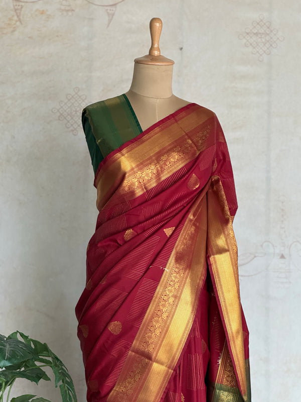 Semi Kanchi Silk Saree in Maroon with Emerald Green Contrast Border & Rich Gold Zari Weaving