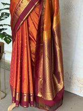 Semi Kanchi Silk Saree in Burnt Orange with Magenta Zari Border & Traditional Buttas