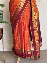 Semi Kanchi Silk Saree in Burnt Orange with Magenta Zari Border & Traditional Buttas