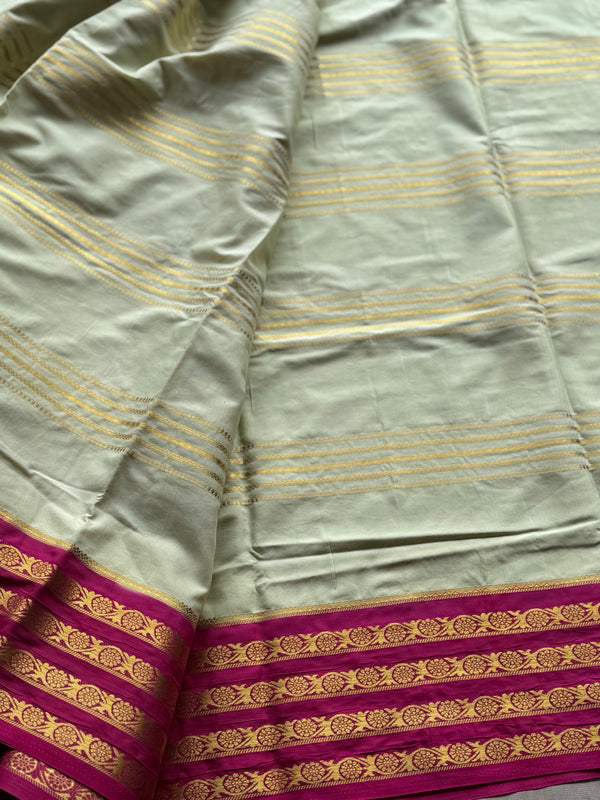 Semi Mysore Crepe Silk Saree in Pastel Green with Gold Zari Lines & Magenta Contrast Border