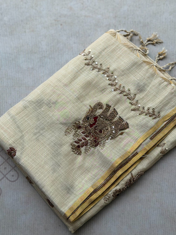 Tejas - Ivory linen saree with hand-embroidered floral & elephant buttas