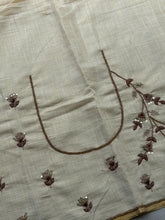 Tejas - Ivory linen saree with hand-embroidered floral & elephant buttas